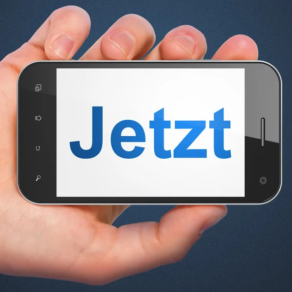 Concepto de tiempo: Jetzt (alemán) en el teléfono inteligente — Foto de Stock