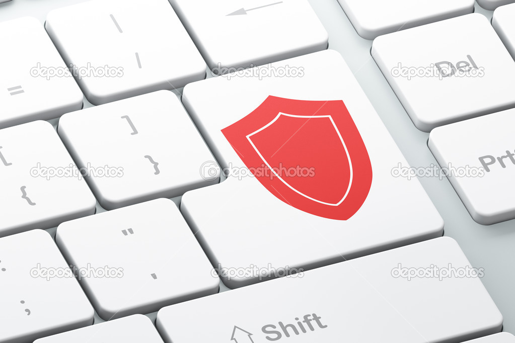 Safety concept: Shield on computer keyboard background