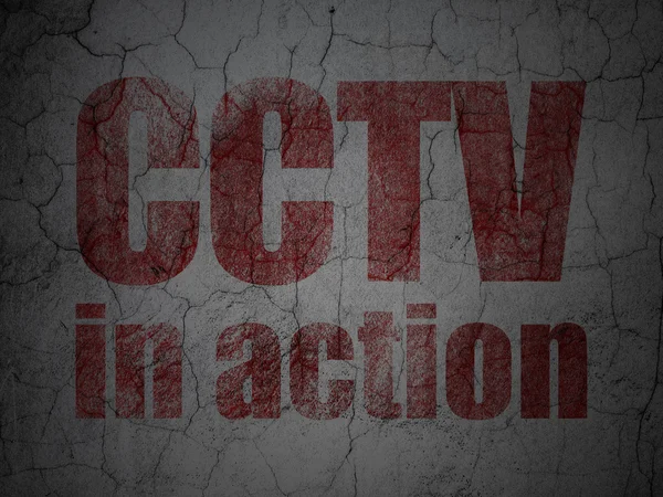 Protection concept: CCTV In action on grunge wall background — Stock Photo, Image