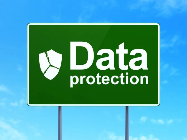 Security concept: Data Protection and Broken Shield on road sign background — Stock Photo, Image