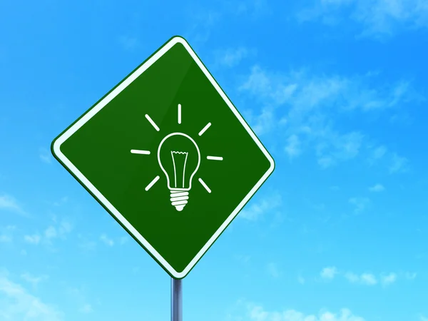 Business concept: Light Bulb on road sign background — Stock Photo, Image