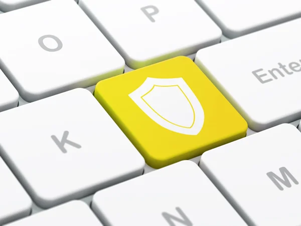 Concetto di protezione: scudo sullo sfondo della tastiera del computer — Foto Stock