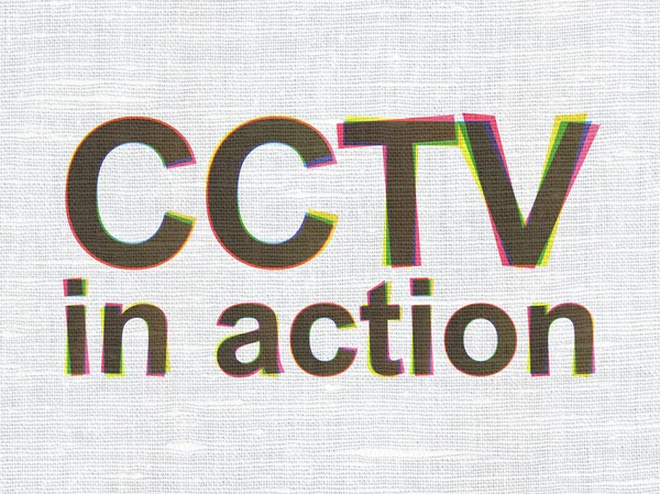 Conceito de segurança: CCTV Em ação sobre fundo de textura de tecido — Fotografia de Stock