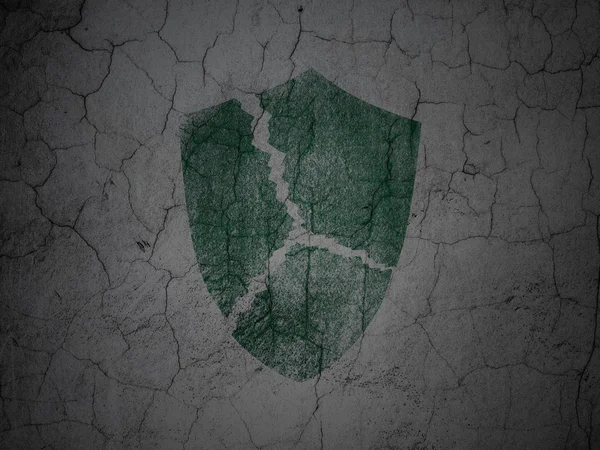 Security concept: Broken Shield on grunge wall background — Stock Photo, Image