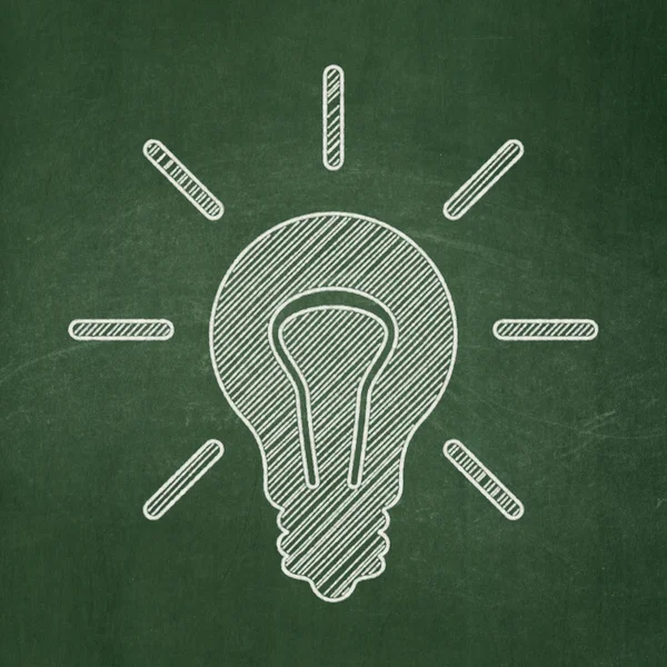 Finance concept: Light Bulb on chalkboard background — Stock Photo, Image