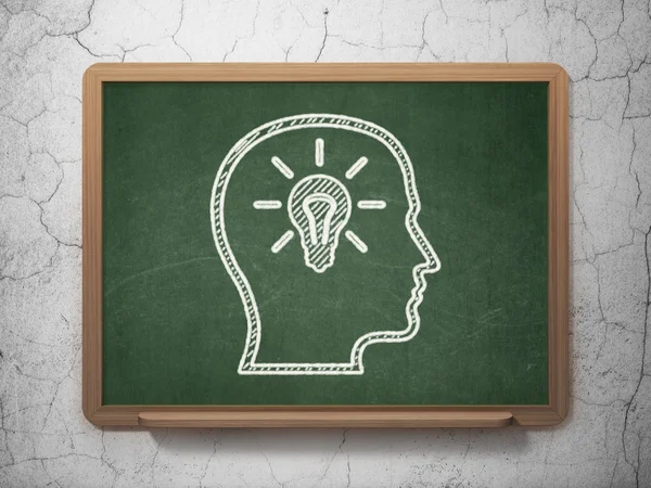 Education concept: Head With Lightbulb on chalkboard background — Stock Photo, Image