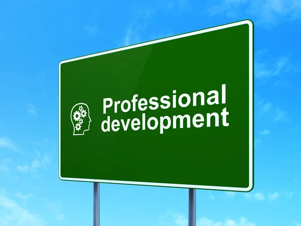 Education concept: Professional Development and Head With Gears on road sign background — Stock Photo, Image