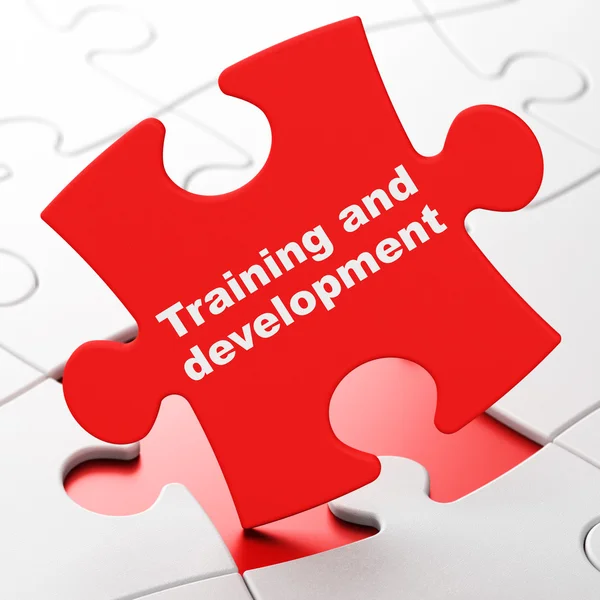 Education concept: Training and Development on puzzle background — Stock Photo, Image