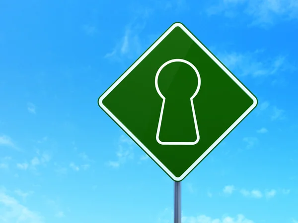 Security concept: Keyhole on road sign background — Stock Photo, Image