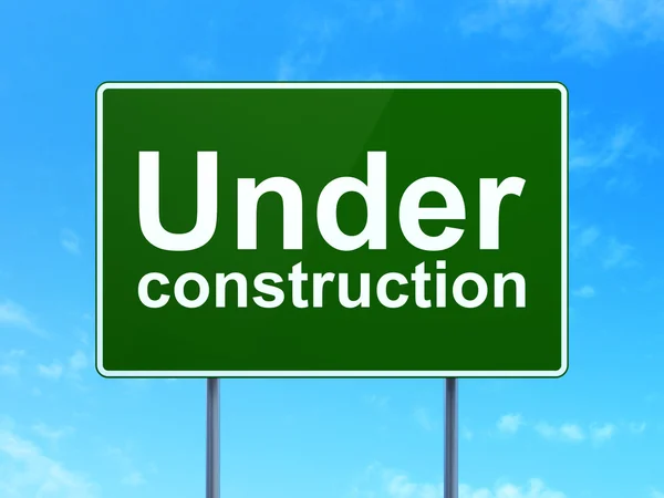 Web design concept: Under Construction on road sign background — Stock Photo, Image