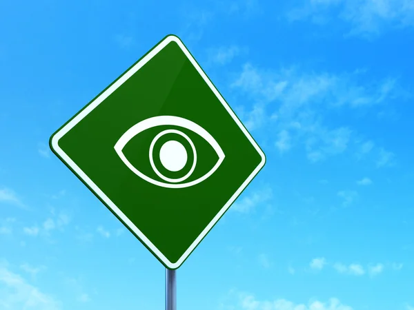 Güvenlik kavramı: yol işareti arka plan üzerinde göz — Stok fotoğraf