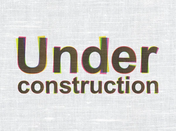 Web design concept: Under Construction on fabric texture background — Stock Photo, Image