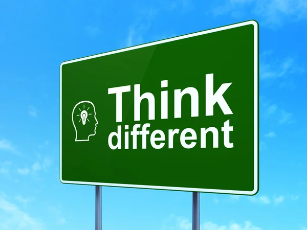 Education concept: Think Different and Head With Lightbulb on road sign background — Stock Photo, Image