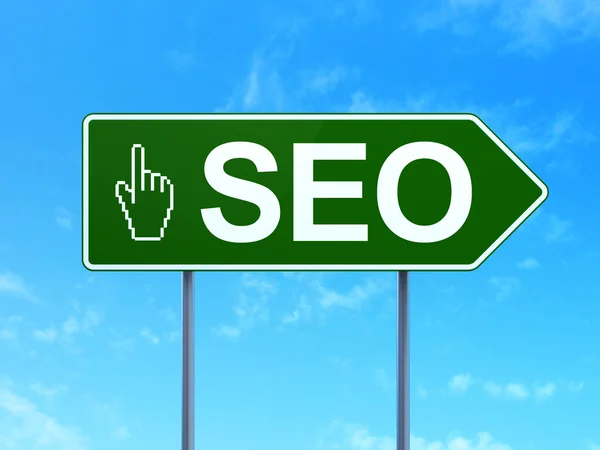 Web design concept: SEO and Mouse Cursor on road sign background — Stock Photo, Image