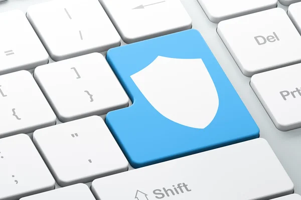 Bescherming concept: Shield op computer toetsenbord achtergrond — Stockfoto