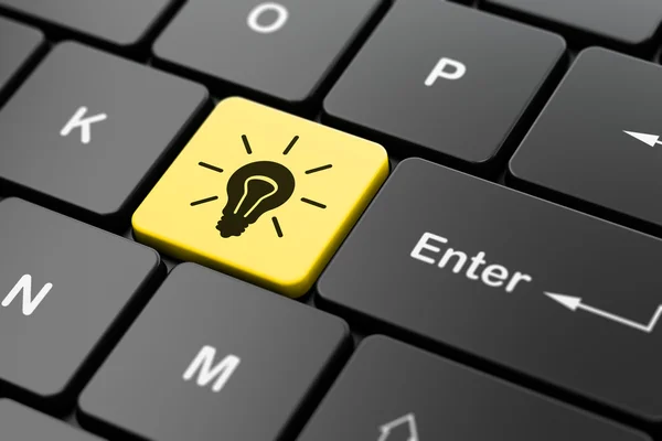 Finance concept: Light Bulb on computer keyboard background — Stock Photo, Image