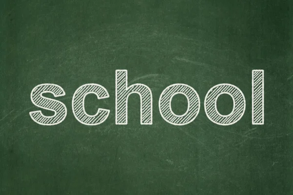 Conceito de educação: Escola sobre fundo quadro-negro — Fotografia de Stock