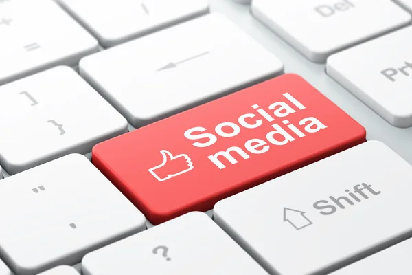 Sociala nätverk koncept: tummen upp och sociala medier på dator tangentbord bakgrund — Stockfoto