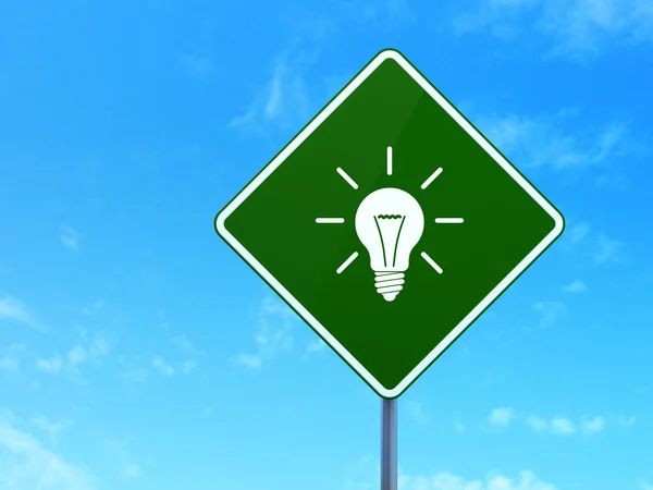 Business concept: Light Bulb on road sign background — Stock Photo, Image