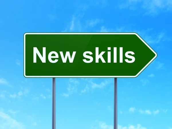 Education concept: New Skills on road sign background — Stock Photo, Image