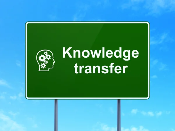 Education concept: Knowledge Transfer and Head With Gears on road sign background — Stock Photo, Image
