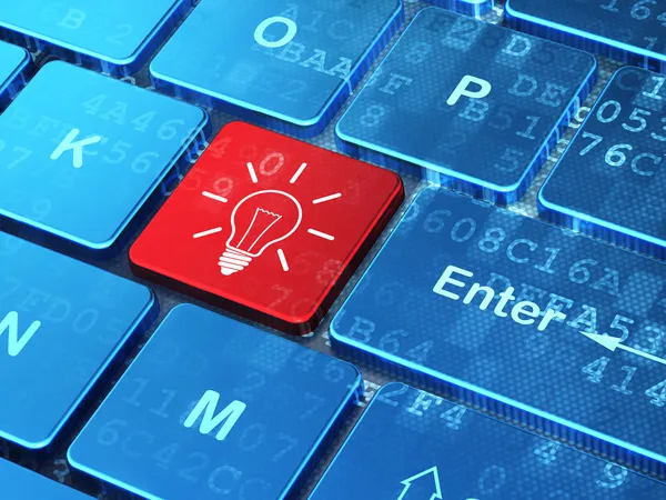 Finance concept: Light Bulb on computer keyboard background — Stock Photo, Image