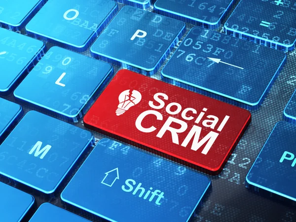 Finance concept: Light Bulb and Social CRM on computer keyboard background — Stock Photo, Image