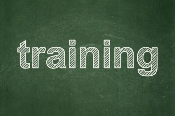 Education concept: Training on chalkboard background — Stock Photo, Image