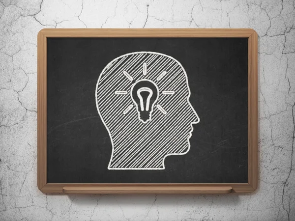 Education concept: Head With Light Bulb on chalkboard background — Stock Photo, Image