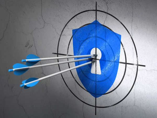 Safety concept: arrows in Shield With Keyhole target on wall background — Stock Photo, Image