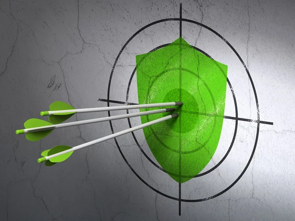 Protection concept: arrows in Shield target on wall background — Stock Photo, Image