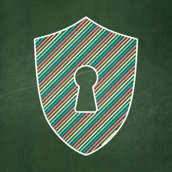 Privacy concept: Shield With Keyhole on chalkboard background — Stock Photo, Image