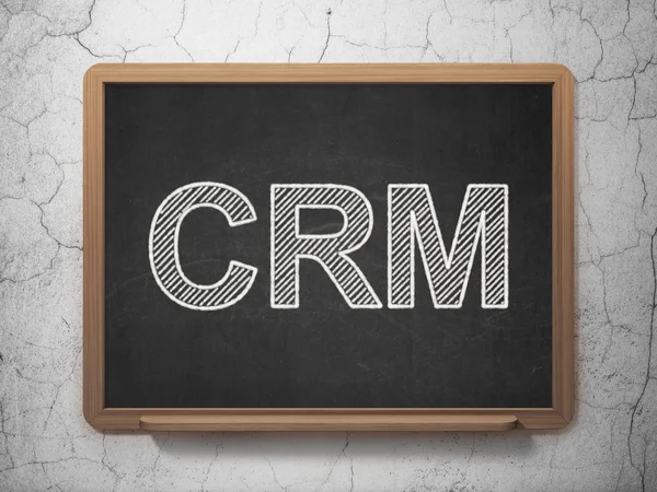 Business concept: CRM on chalkboard background — Stock Photo, Image