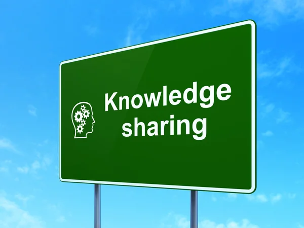 Education concept: Knowledge Sharing and Head With Gears on road sign background — Stock Photo, Image