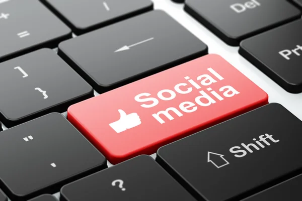 Sociale media concept: duim omhoog en sociale media op computer toetsenbord achtergrond — Stockfoto