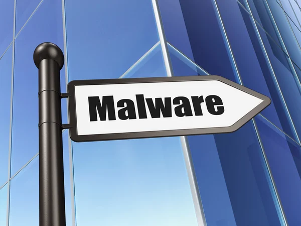 Veiligheidsconcept: malware op achtergrond gebouw ondertekenen — Stockfoto