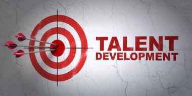 Education concept: target and Talent Development on wall background