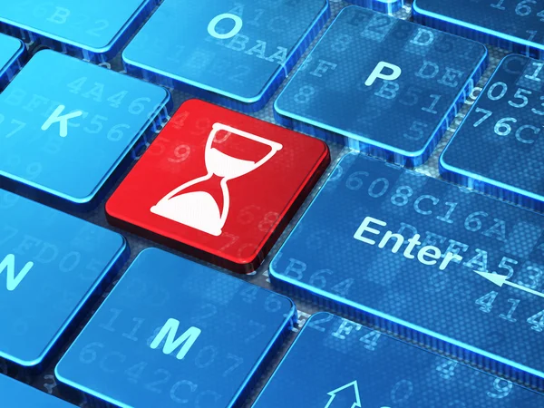 Time concept: Hourglass on computer keyboard background — Stock Photo, Image