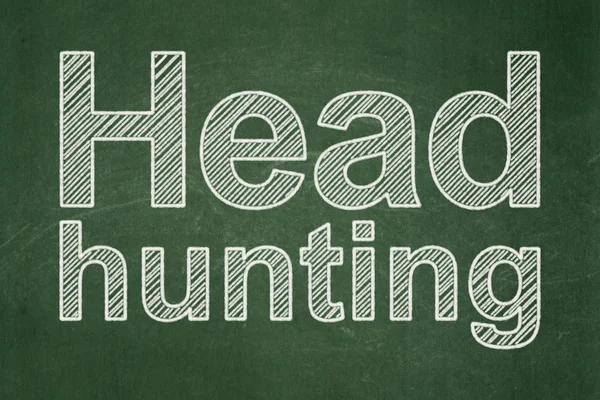 Conceito de negócio: Head Hunting em fundo quadro-negro — Fotografia de Stock