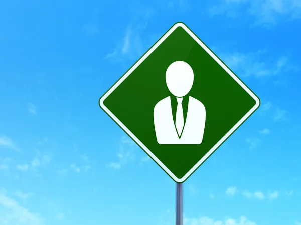 Advertising concept: Business Man on road sign background — Stock Photo, Image