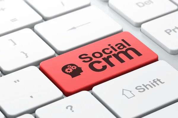 财务理念： 头部齿轮与计算机键盘背景上的社交型 crm — 图库照片