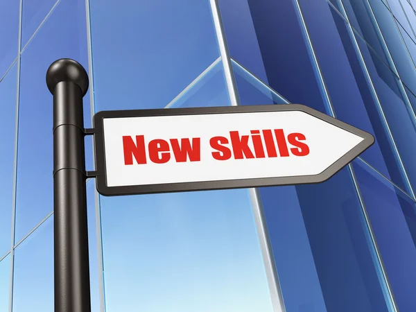 Education concept: sign New Skills on Building background — Stock Photo, Image
