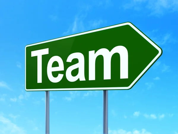 Business concept: Team on road sign background — Stock Photo, Image