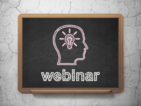 Education concept: Head With Lightbulb and Webinar on chalkboard background — Stock Photo, Image