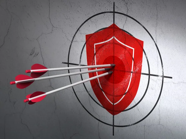 Protection concept: arrows in Shield target on wall background — Stock Photo, Image