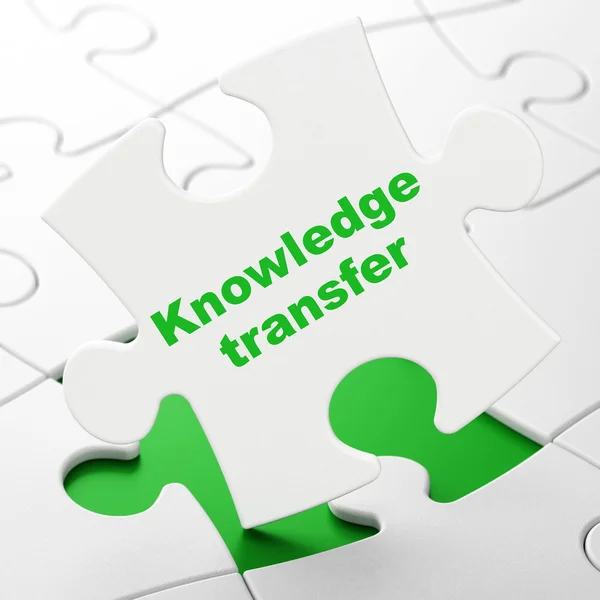 Education concept: Knowledge Transfer on puzzle background — Stock Photo, Image