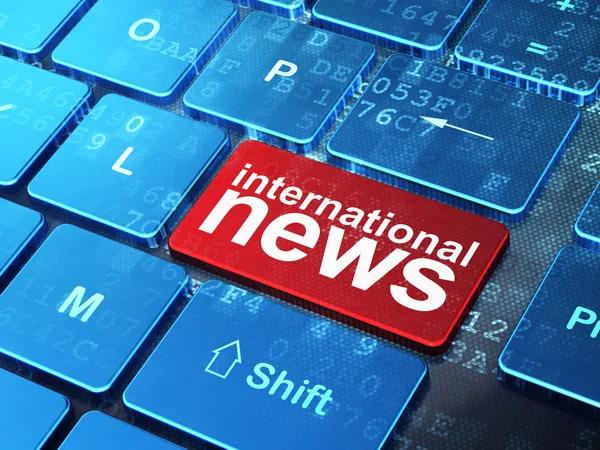 Concepto de noticias: Noticias Internacionales en el fondo del teclado del ordenador —  Fotos de Stock