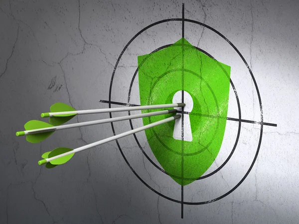 Security concept: arrows in Shield With Keyhole target on wall background — Stock Photo, Image