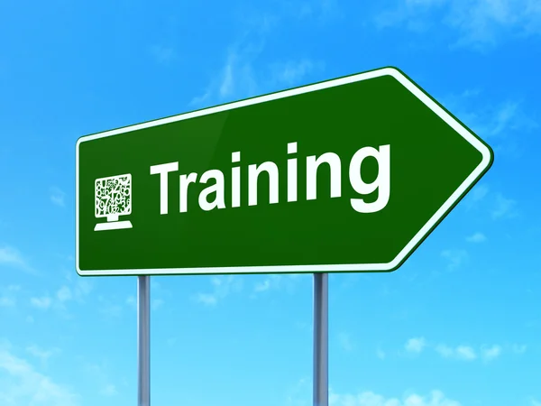 Education concept: Training and Computer Pc on road sign background — Stock Photo, Image