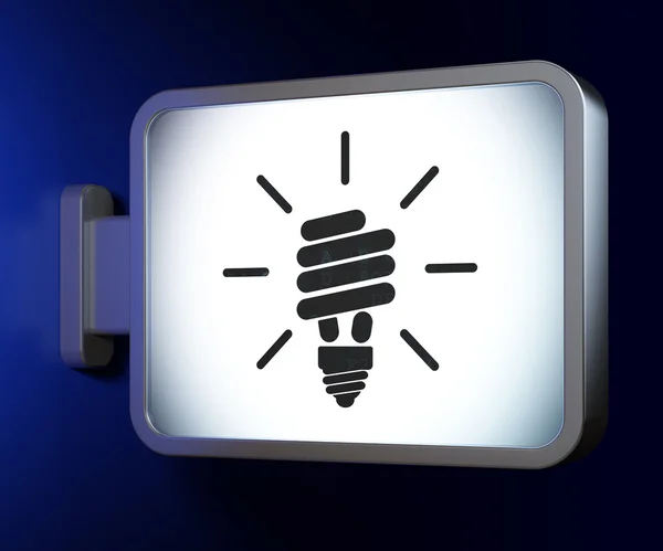 Концепция бизнеса: энергосберегающая лампа на фоне рекламного щита — стоковое фото